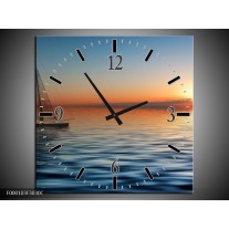 Wandklok op Canvas Zonsondergang | Kleur: Blauw, Geel, Oranje | F000103C