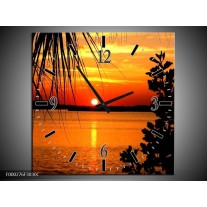 Wandklok op Canvas Zonsondergang | Kleur: Oranje, Geel, Bruin | F000276C